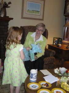 Annie gets in on the action opening Nana's gifts. 